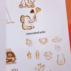 A collection of cute baby shower-themed motifs. I can incorporate elements like baby elephants, pacifiers, bottles, prams, and little footprints into your godh bharai mehndi design.