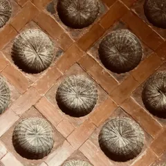 Here, we used woven bamboo baskets as the filler material in the ceiling slab. This sustainable technique leaves a unique, textured imprint on the ceiling, adding geometric beauty and celebrating natural, local craft.