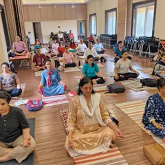 Participants in our Pranayama workshop engage in a guided meditation. Our workshops provide a space for deep, experiential learning and collective practice.