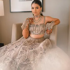 This princess-like sangeet look is all about elegance. You'll learn to create a sharp, high ponytail and a sophisticated makeup look to match a dreamy ballgown.