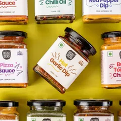 This creative shot for Pepper Wicks showcases their variety of dips and sauces. The grid like arrangement is eye catching, and having one jar tilted makes the composition more dynamic. It’s a great way to display a full product line.