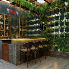 We can integrate a fully functional and stylish bar into your outdoor space. This terrace bar features a vertical garden wall, hanging ferns from the pergola, and warm under-counter lighting, creating a vibrant and inviting atmosphere for hosting guests.