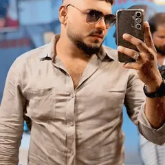 The client taking a selfie to show off his fresh haircut. The sharp lines of the fade and the textured top look great from the front.