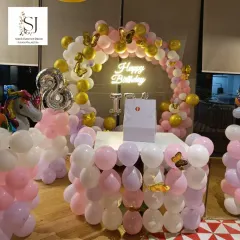 This enchanting unicorn-themed decor was set up for an intimate birthday celebration. The pastel balloon arch with a neon sign created a magical photo corner for the birthday girl and her guests.