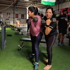 Two of our members working on their dumbbell curls. It's great to see the focus and determination as they build their upper body strength together.
