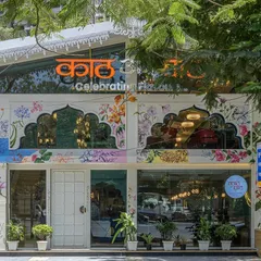 A restaurant's exterior becomes a public canvas, celebrating the rich foliage of Maharashtra. This hand-painted facade blends vibrant colors and intricate line work, turning the building itself into a landmark and a piece of storytelling art.