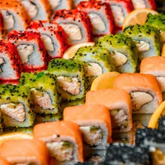 A vibrant and colorful close-up of our assorted sushi rolls. This image highlights the freshness of the ingredients and the meticulous craftsmanship that goes into each piece.