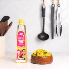 This shot places Welly Belly's sunflower oil in a clean, bright kitchen setting next to a bowl of poha. This shows the product in its natural environment and suggests a use case, making it relatable for home cooks.