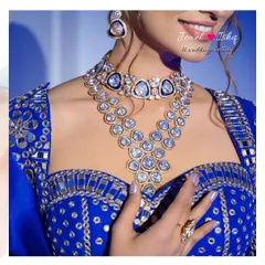 For a Sangeet or Reception, you can truly shine. This bold, layered Polki necklace with a unique design is perfect for a modern bride. The large uncut stones catch the light beautifully, making it a centerpiece for your glamorous evening look.