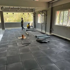 The space during the build-out phase. Laying the foundation, literally, for our home for movement.