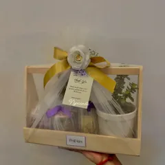 Another angle of the elegant wedding hamper, showing the beautiful wrapping and personalized tag. It's a thoughtful gift that guests will truly appreciate.
