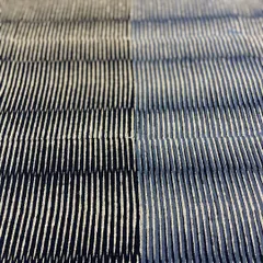 This mid-century modern settee is beautifully upholstered in our hand-printed linen. The 'Sonoma' pattern in Glitter Graphite, designed by Seema Krish, creates a unique texture with its striking yet muted metallic gold on black.