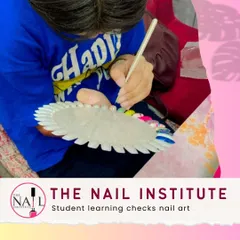 This student is practicing checks nail art on a color wheel, perfecting her line work and spacing for this classic design.