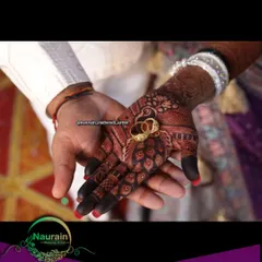 The perfect shot. A deep, dark henna stain provides a beautiful contrast for the wedding rings, symbolizing the start of a new journey.