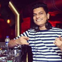 Having a great time behind the decks. My job is to make you dance, and I love every minute of it.