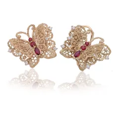 My butterfly eartops, symbolizing transformation and resilience. These are handcrafted in 18k gold with a delicate lace-wing texture, with bodies made of marquise-cut Mozambique rubies and diamond accents.