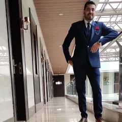 This is a custom three-piece suit, showing how a waistcoat adds another layer of formality. The fit is kept modern and sharp, not boxy.