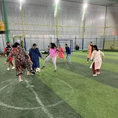 Football is for everyone. Here, you'll find a welcoming and supportive environment where adults of all genders and skill levels come together for the love of the game. This shot from our community fest captures the pure joy and camaraderie we foster.