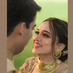 A beautiful close-up of the bride looking lovingly at her groom during their Goa wedding. The soft light and her radiant smile capture a moment of pure happiness.