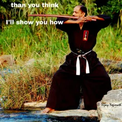 Your body is more capable than you think. Here, I hold a ready stance with a bokken, a position that requires focus, balance, and control, principles I teach in every class.