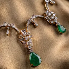 A detailed view of the Aurora Verde necklace. Notice how the pear-shaped emerald drops are complemented by the structured diamond settings. This piece is about letting the quality of the gemstones and the precision of the craft speak for themselves.