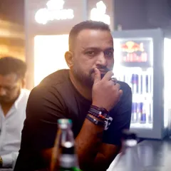 Every drop is a journey. A candid, thoughtful portrait taken at the bar, reflecting my deep connection to the music and the nightlife scene.