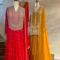 I love the contrast of a bold red with delicate silver embroidery. This anarkali set is designed for a grand entrance, combining traditional motifs with a flowing, modern silhouette.