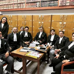 Taking a brief coffee break with colleagues during a busy afternoon at the Delhi High Court. These moments of conversation are essential for collaboration and strategy.