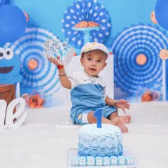 A Cookie Monster theme for this little guy's first birthday. I love creating personalized setups, complete with a custom cake and matching blue decor.