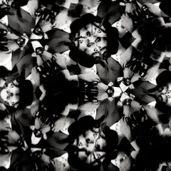 A groom's portrait seen through a kaleidoscope, creating a unique, abstract, and mesmerizing image. This is a fun technique I use for creative shots.