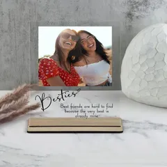 This acrylic photo plaque is a wonderful gift for your best friend. It features your favorite "Besties" photo along with a heartfelt quote, all set in a modern wooden stand.