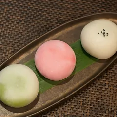 A beautiful trio of our Mochi Wagashi, showcasing the soft, round shape and delicate colors of the strawberry, matcha, and vanilla flavors.