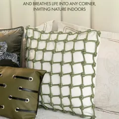 This unique knotted net cushion cover in green and white breathes life into any corner, inviting a sense of nature indoors with its distinct texture and fresh design.