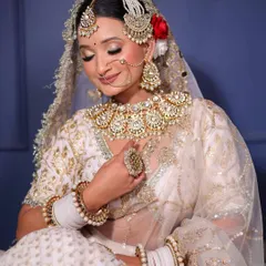 A detailed view of the exquisite Kundan bridal set. Notice the intricate work on the oversized necklace, the elegant passa, and the matching statement ring. Every piece is designed to make you feel like royalty.