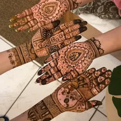 A collection of hands from the bridal party, showcasing a variety of designs from full bridal to simpler guest mehendi.