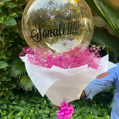 Simplicity can be so beautiful. This arrangement features a full bouquet of delicate pink baby's breath, paired with a personalized confetti-filled bubble balloon for a sweet and elegant birthday surprise.