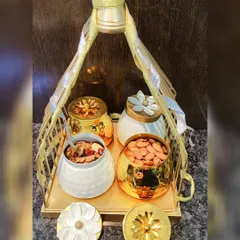 This is luxury gifting at its finest. I curated this set with four decorative jars, two in textured white ceramic and two in polished gold, all held within a beautiful golden tray with a bird-motif handle. It’s perfect for high-end corporate or wedding gifts.
