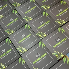 An army of 'Nature First' hampers ready to be shipped out to male influencers. The branding is consistent and sharp across all the boxes.