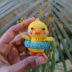This little duckling is ready for a swim with its own tiny floatie! I love adding cute accessories to my animal creations to give them more personality.