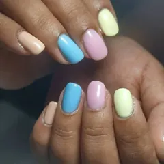 A softer take on the multi-color trend, using muted pastel shades of peach, blue, pink, and yellow. This is a great way to wear color in a more understated way.