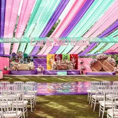 We love bringing creative themes to life, like this vibrant carnival-style Haldi. By using a bold color palette of purple, mint, and pink drapes and a custom-designed stage, we transformed a traditional ceremony into a high-energy, modern celebration.
