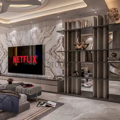 This view of the master suite showcases the integrated media wall, featuring a book-matched marble panel and a contemporary open shelving unit that doubles as a stylish room divider.