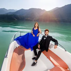 A glamorous pre-wedding shoot on the waters of Tehri lake. I arrange for the speedboat and help you style the perfect look, like this flowing blue gown, to create stunning, high-fashion portraits against the mountain scenery.