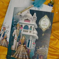 A closer look at the intricate illustration work, where every detail from the bride's lehenga to the palace arches is crafted with care.