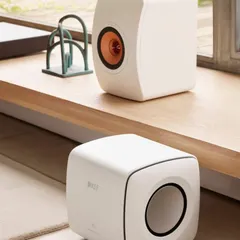 The KEF LS50 Meta bookshelf speakers paired with a KC62 subwoofer deliver a remarkably full and detailed sound from a compact system. This is a great solution for high-fidelity audio in smaller rooms.
