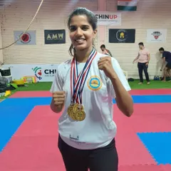 We are incredibly proud of our champions. Here, one of our dedicated students showcases her four gold medals from the 4th Mumbai City Kickboxing Championship. This is a testament to her hard work and the effectiveness of our training methods.
