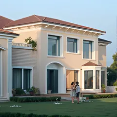 Expansive glass windows are framed by classic architectural moldings, creating a dialogue between modern openness and traditional elegance. The manicured lawn adds to the sense of a grand, welcoming estate.