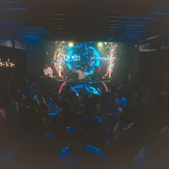 A wide shot of the party in full swing at Cavalry The Lounge. You can see the packed floor, the impressive LED screen, and the cold pyro effects creating a spectacular moment.