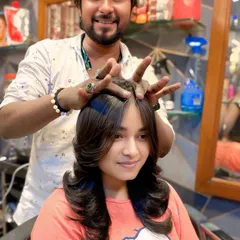 This client wanted a classic layered cut with lots of body. I styled it with an outward curl at the ends to emphasize the different lengths and create a soft, glamorous finish.