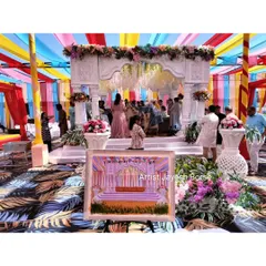 My easel and canvas set against the backdrop of the wedding mandap. The goal is to capture not just the couple, but also the beautiful decor and energy of the event.